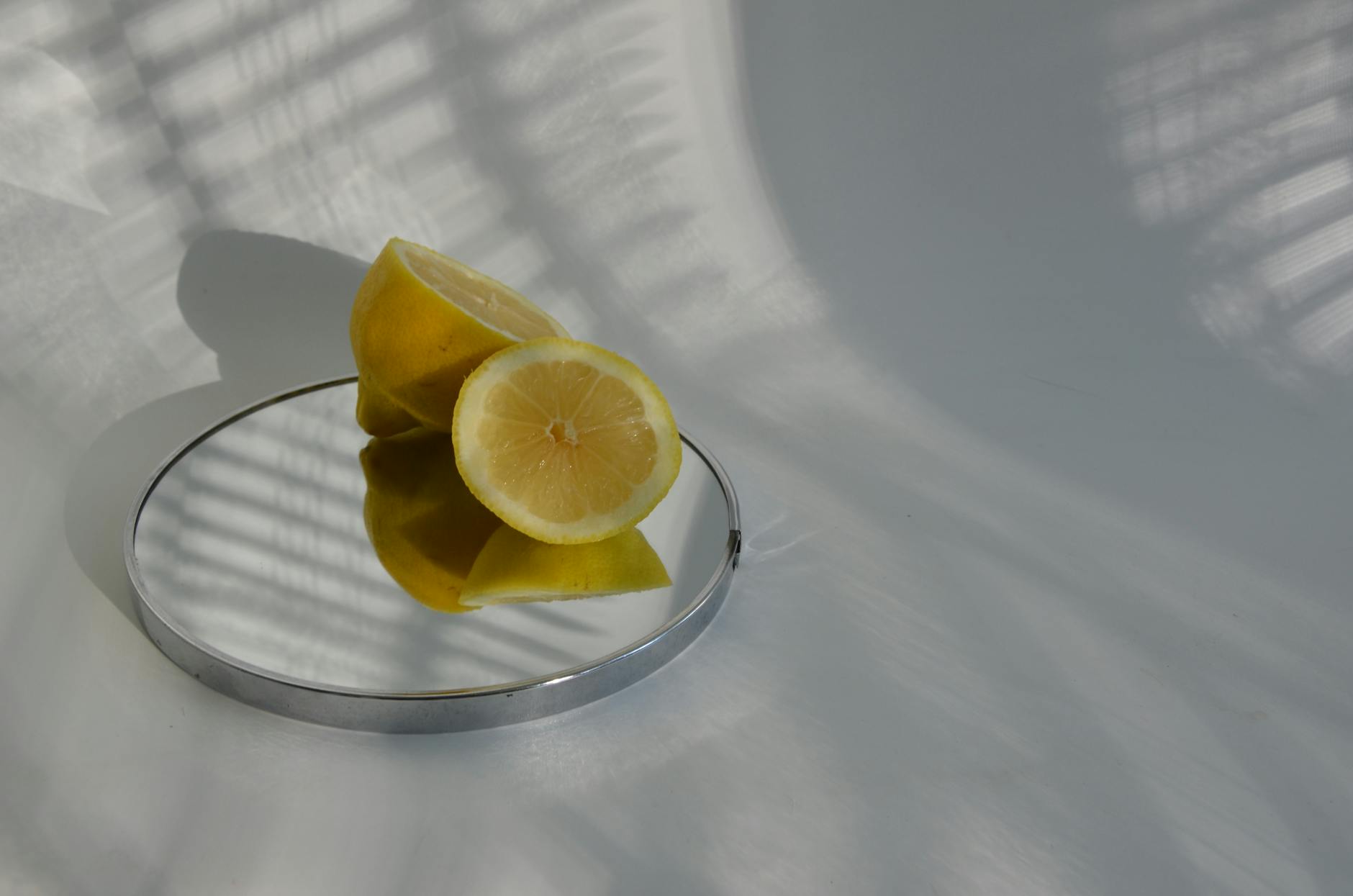 Yellow clitoral vibrator surrounded by fresh bananas on a bright yellow background, symbolizing natural pleasure and comfort